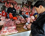 中国大陆的猪肉价格高居不下。(TEH ENG KOON/AFP/Getty Images)