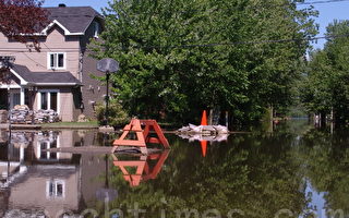 2011年魁北克省南部黎塞留谷地遭受嚴重洪災，大量居民房屋被淹。（攝影：孫萍/大紀元）