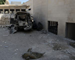 2012年9月2日，在敘利亞大馬士革一座軍事總部附近發生兩次爆炸，造成至少6名高級安全官員受傷。圖為阿布魯馬納區發生爆炸，車輛殘骸。（HO / SANA / AFP）