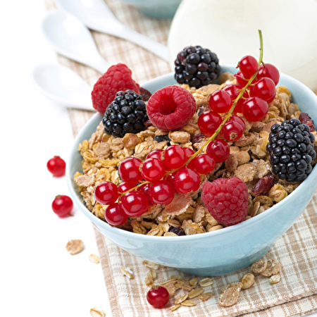 muesli with fresh berries and milk, close-up muesli with fresh berries and milk, close-up