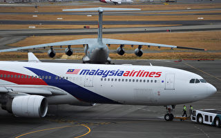 今年发生两起重大空难事件的马来西亚航空公司周五（8月29日）宣布裁员6,000人，占其员工总数的30%，同时将缩短航线和更换首席执行官。(Greg Wood - Pool/Getty Images)