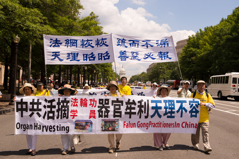 2014年7月17日美國首都華盛頓DC法輪功十五年和平反迫害集會遊行(戴兵/大紀元)