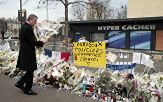 白思豪造访巴黎 向遇难者献花