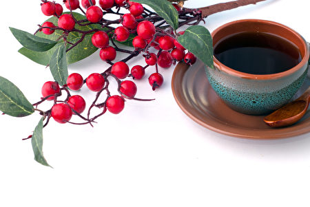 Cup of coffee and branch of hawthorn, breakfast background Cup of coffee and branch of hawthorn, breakfast background