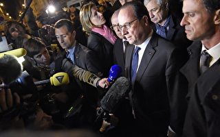 法国总统奥朗德和总理瓦斯等官员抵达被袭击的巴塔克朗演出厅（Bataclan）。(MIGUEL MEDINA/AFP/Getty Images)