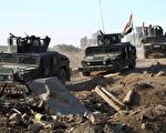12月22日，伊拉克反恐部队新闻发言人表示，政府军已经进入到拉马迪（Ramadi）市中心，对在周末之前夺回拉马迪表示乐观。(AHMAD AL-RUBAYE/AFP/Getty Images)
