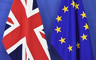 研究顯示，英國若投票贊成脫歐，到2020年經濟產出的減少程度，等同於經濟增長率（GDP）縮減5%。圖英國國旗（左）與歐盟盟旗。( EMMANUEL DUNAND/AFP/Getty Images)