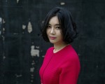 脫北女孩李炫秀今年3月應邀到北京參加書展活動，推銷其作品《擁有七個名字的女孩》。（AFP/Getty Images)