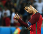 Portugal's forward Cristiano Ronaldo reacts after the Euro 2016 group F football match between Portugal and Iceland at the Geoffroy-Guichard stadium in Saint-Etienne on June 14, 2016. / AFP / ODD ANDERSEN        (Photo credit should read ODD ANDERSEN/AFP/Getty Images)