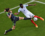 England's defender Danny Rose (R) and Wales' forward Gareth Bale vie for the ball during the Euro 2016 group B football match between England and Wales at the Bollaert-Delelis stadium in Lens on June 16, 2016. / AFP / PHILIPPE HUGUEN        (Photo credit should read PHILIPPE HUGUEN/AFP/Getty Images)