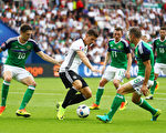 PARIS, FRANCE - JUNE 21: Mario Gomez (2nd L) of Germany controls the ball under pressure of Craig Cathcart  (1st L), Corry Evans (3rd R) and Aaron Hughes (2nd R) of Northern Ireland during the UEFA EURO 2016 Group C match between Northern Ireland and Germany at Parc des Princes on June 21, 2016 in Paris, France.  (Photo by Clive Mason/Getty Images)