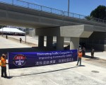 罗兰岗99大华超市旁的铁路公路交叉口改造工程竣工，6月17日开放使用。（李姗/大纪元）