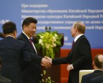普京访华签近30商业交易 中国提前还债$6亿