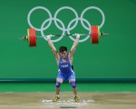RIO DE JANEIRO, BRAZIL - AUGUST 10:  Xiaojun Lyu of China lifts during the Men's 77kg Group A weightlifting contest on Day 5 of the Rio 2016 Olympic Games at Riocentro - Pavilion 2 on August 10, 2016 in Rio de Janeiro, Brazil.  (Photo by Julian Finney/Getty Images)