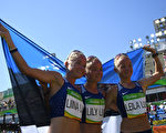 Estonia's Liina Luik, Estonia's Lily Luik and Estonia's Leila Luik pose after crossing the finish line of the Women's Marathon during the athletics event at the Rio 2016 Olympic Games at Sambodromo in Rio de Janeiro on August 14, 2016.   / AFP / POOL / Johannes EISELE        (Photo credit should read JOHANNES EISELE/AFP/Getty Images)