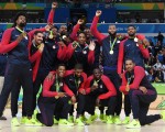 Gold medallists USA's forward Jimmy Butler, USA's guard Kevin Durant, USA's centre DeAndre Jordan, USA's guard Kyle Lowry, USA's forward Harrison Barnes, USA's guard Demar Derozan, USA's guard Kyrie Irving, USA's guard Klay Thompson, USA's centre DeMarcus Cousins, USA's guard Paul George, USA's forward Draymond Green and USA's forward Carmelo Anthony pose after the final of the Men's basketball competition at the Carioca Arena 1 in Rio de Janeiro on August 21, 2016 during the Rio 2016 Olympic Games. / AFP / Mark RALSTON        (Photo credit should read MARK RALSTON/AFP/Getty Images)