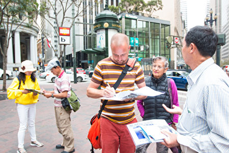 舊金山法輪功學員「真相小遊行」 為反活摘徵簽