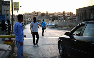 美國國防部長卡特週三透露，爲了徹底打擊伊斯蘭國（IS），進攻IS所謂「首都」拉卡的戰役將在幾個星期內展開。 圖為拉卡。(MEZAR MATAR/AFP/Getty Images)