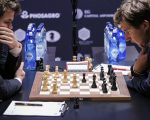 「世界棋王」卡爾森（左）和挑戰者卡爾亞金（右）在比賽中。 (KENA BETANCUR/AFP/Getty Images)