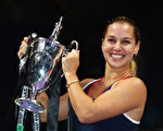 SINGAPORE - OCTOBER 30:  Dominika Cibulkova of Slovakia poses with the trophy after victory in her singles final against Angelique Kerber of Germany during day 8 of the BNP Paribas WTA Finals Singapore at Singapore Sports Hub on October 30, 2016 in Singapore.  (Photo by Clive Brunskill/Getty Images)