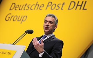 德國郵政首席執行官Frank Appel表示，第三季度取得了公司歷史性好成績。    (Photo credit should read （OLIVER BERG/AFP/Getty Images）