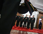 BEIJING, CHINA - MARCH 15:  Delegates from Chinese People's Liberation Army take photos at the entrance of the meeting room for the fifth plenary meeting of the National People's Congress at the Great Hall of the People on March 15, 2013 in Beijing, China. Li Keqiang was elected as China's Premier Friday at the 12th National People's Congress, the country's top legislature.  (Photo by Feng Li/Getty Images)