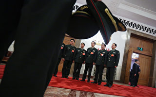 BEIJING, CHINA - MARCH 15:  Delegates from Chinese People's Liberation Army take photos at the entrance of the meeting room for the fifth plenary meeting of the National People's Congress at the Great Hall of the People on March 15, 2013 in Beijing, China. Li Keqiang was elected as China's Premier Friday at the 12th National People's Congress, the country's top legislature.  (Photo by Feng Li/Getty Images)
