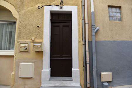 The door of an apartment building is pictured in Marseillan, about 40 kilometres southwest from Montpellier, southern France, on February 10, 2017, where suspects believed to be involved in plotting an attack were arrested by French anti-terrorist police (RAID). Four people including a 16-year-old girl were arrested on February 10 by anti-terrorist police in Montpellier on suspicion of preparing an attack, a police source said. The other suspects were aged 20, 26 and 33, according to the source. The four were arrested after buying acetone, a highly flammable liquid that can be used to make bombs. France remains on high alert after a wave of attacks which began two years ago that has claimed more than 200 lives. / AFP / SYLVAIN THOMAS (Photo credit should read SYLVAIN THOMAS/AFP/Getty Images)