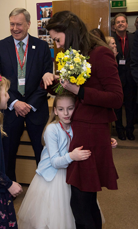 PONTYPOOL, WALES - FEBRUARY 22: Catherine, Duchess of Cambridge gets a hug from Ypapanti Galimatakis during her visit to MIST, a child and adolescent mental health project, part of Action for Children which supports vulnerable families in Wales and across the UK on February 22, 2017 in Pontypool, United Kingdom. (Photo by Paul Edwards - WPA Pool/Getty Images)