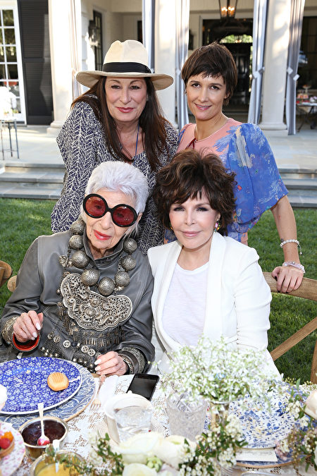 LOS ANGELES, CA - APRIL 27: (L-R) Anjelica Huston, Cassandra Huysentruyt Grey, Iris Apfel and Carole Bayer Sager attend VIOLET GREY's She's So Violet Garden Tea honoring Iris Apfel on April 27, 2015 in Los Angeles, California. (Photo by Jonathan Leibson/Getty Images for VIOLET GREY)