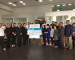 工业市速霸陆（Subaru）经销商，周一（3月27日）捐出价值17,277美元的支票，帮助非营利组织Circle of Friends维持弱势儿童项目营运。（刘宁／大纪元）