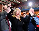 BALLYMENA, NORTHERN IRELAND - MARCH 03:  Michelle O'Neill, leader of Sinn Fein in Northern Ireland (C) celebrates winning her seat for Mid Ulster while surrounded by Francie Molloy, (L) and Ian Milne (R) at the Seven Towers Leisure Centre count in the Northern Ireland assembly election on March 3, 2017 in Ballymena, Northern Ireland. A snap election was called following the resignation of the Deputy First Minister Martin McGuiness, with indications showing that voter turnout yesterday was considerably higher than in May last year. The first declarations are expected around lunchtime today. (Photo by Jeff J Mitchell/Getty Images)