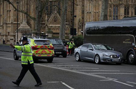 The Jagaur car of British Prime Minister Theresa May (R) is driven away from the Houses of Parliament in central London on March 22, 2017 during an emergency incident. / AFP PHOTO / Daniel LEAL-OLIVAS (Photo credit should read DANIEL LEAL-OLIVAS/AFP/Getty Images)