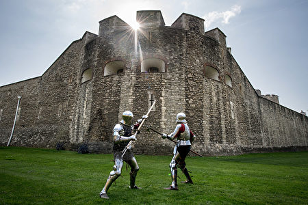 LONDON, ENGLAND - APRIL 06: Historical interpreters Mark Griffin (L) and Tom Fermor during a poleaxe fighting demonstration at the Tower of London, ahead of the 'Go Medieval at the Tower' festival at Tower of London on April 6, 2017 in London, England. The festival takes place from 29 April 2017 to 1 May 2017 and recreates the world of 1445 - offering knights sword fighting, crossbow shooting and appearances from Queen Margaret of Anjou and King Henry VI. (Photo by Chris J Ratcliffe/Getty Images)
