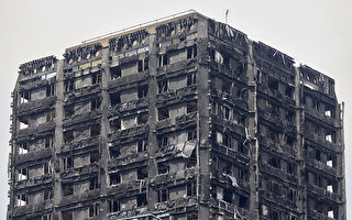 英國倫敦住宅大樓格蘭菲塔14日凌晨慘遭惡火吞噬，奪走79條人命。（AFP PHOTO / NIKLAS HALLE'N）