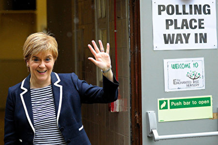 Scotland's First Minister and leader of the Scottish National Party (SNP), Nicola Sturgeon, gestures as she leaves a Polling Station after casting her ballot paper, in Glasgow, Scotland, on June 8, 2017, as Britain holds a general election. As polling stations across Britain open on Thursday, opinion polls show the outcome of the general election could be a lot tighter than had been predicted when Prime Minister Theresa May announced the vote six weeks ago. / AFP PHOTO / Andy Buchanan (Photo credit should read ANDY BUCHANAN/AFP/Getty Images)