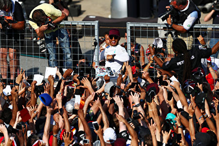 MONTREAL, QC - JUNE 11: Lewis Hamilton of Great Britain and Mercedes GP celebrates with the fans on the pit straight after winning the Canadian Formula One Grand Prix at Circuit Gilles Villeneuve on June 11, 2017 in Montreal, Canada. (Photo by Dan Istitene/Getty Images)