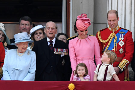 TOPSHOT - Members of the Royal Family (L-R) Britain's Queen Elizabeth II, Vice Admiral Timothy Laurence, Britain's Princess Beatrice of York, Britain's Prince Philip, Duke of Edinburgh, Britain's Catherine, Duchess of Cambridge (with Princess Charlotte and Prince George), and Britain's Prince William, Duke of Cambridge, stand on the balcony of Buckingham Palace to watch a fly-past of aircraft by the Royal Air Force, in London on June 17, 2017. The ceremony of Trooping the Colour is believed to have first been performed during the reign of King Charles II. In 1748, it was decided that the parade would be used to mark the official birthday of the Sovereign. More than 600 guardsmen and cavalry make up the parade, a celebration of the Sovereign's official birthday, although the Queen's actual birthday is on 21 April. / AFP PHOTO / Chris J Ratcliffe (Photo credit should read CHRIS J RATCLIFFE/AFP/Getty Images)