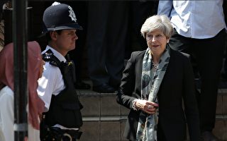 英國首相梅發表聲明說，「仇恨與邪惡」將永遠不會成功。(Photo credit should read DANIEL LEAL-OLIVAS/AFP/Getty Images)