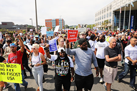 BOSTON, MA - AUGUST 19: Thousands of protesters march in Boston against a planned 'Free Speech Rally' just one week after the violent 'Unite the Right' rally in Virginia left one woman dead and dozens more injured on August 19, 2017 in Boston, United States. Although the rally organizers stress that they are not associated with any alt-right or white supremacist groups, the city of Boston and Police Commissioner William Evans are preparing for possible confrontations at the afternoon rally. (Photo by Spencer Platt/Getty Images)