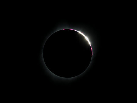 The "Bailey's Beads" effect is seen during a total solar eclipse viewed from the Lowell Observatory Solar Eclipse Experience on August 21, 2017 in Madras, Oregon. Emotional sky-gazers on the US West Coast cheered and applauded Monday as the Sun briefly vanished behind the Moon -- a rare total solar eclipse that will stretch across North America for the first time in nearly a century. / AFP PHOTO / STAN HONDA (Photo credit should read STAN HONDA/AFP/Getty Images)