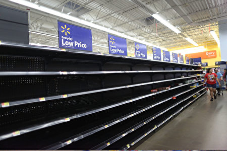 HOUSTON, TX - AUGUST 24: The bread section of a Walmart store is empty as people prepare for the possible arrival of Hurricane Harvey on August 24, 2017 in Houston, Texas. Hurricane Harvey has intensified into a hurricane and is aiming for the Texas coast with the potential for up to 3 feet of rain and 125 mph winds.(Photo by Joe Raedle/Getty Images)