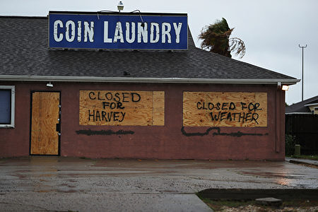 CORPUS CHRISTI, TX - AUGUST 25: A sign on a business reads, 'Closed for Harvey', as people prepare for approaching Hurricane Harvey on August 25, 2017 in Corpus Christi, Texas. Hurricane Harvey has intensified into a hurricane and is aiming for the Texas coast with the potential for up to 3 feet of rain and 125 mph winds. (Photo by Joe Raedle/Getty Images)