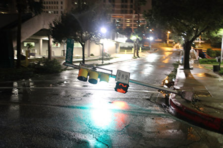 CORPUS CHRISTI, TX - AUGUST 26: A street light is knocked off it's base by the winds of Hurricane Harvey on August 26, 2017 in Corpus Christi, Texas. Hurricane Harvey had intensified into a hurricane and hit the Texas coast as damage is being assessed. (Photo by Joe Raedle/Getty Images)