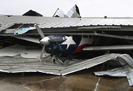 A badly damaged light plane in its hanger at Rockport Airport after heavy damage when Hurricane Harvey hit Rockport, Texas on August 26, 2017. Hurricane Harvey slammed into the Texas coast late Friday, unleashing torrents of rain and packing powerful winds, the first major storm to hit the US mainland in 12 years. / AFP PHOTO / MARK RALSTON (Photo credit should read MARK RALSTON/AFP/Getty Images)