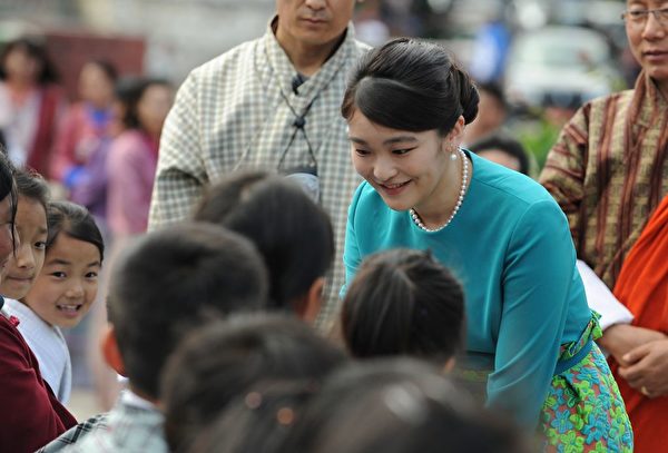 Japanese Princess Mako meets Bhutanese schoolchildren due to perform at the opening ceremony for 'Japan Week' at the Clock Tower in Thimpu on June 2, 2017. Japanese Princess Mako, the oldest of Emperor Akihito's grandchildren, is on a nine-day official visit to Bhutan. / AFP PHOTO / DIPTENDU DUTTA (Photo credit should read DIPTENDU DUTTA/AFP/Getty Images)