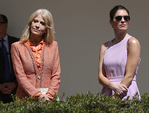 WASHINGTON, DC - APRIL 05: White House Senior Advisor, Kellyanne Conway (L), stand with White House Communications Director, Hope Hicks, during a news conference with U.S. President Donald Trump and King Abdullah II of Jordan, at the White House April 5, 2017 in Washington, DC. President Trump held talks on Middle East peace process and other bilateral issues with King Abdullah II. (Photo by Mark Wilson/Getty Images)