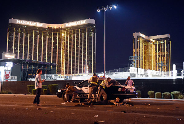 LAS VEGAS, NV - OCTOBER 01: Las Vegas police stand guard along the streets outside the Route 91 Harvest Country music festival groundss of the Route 91 Harvest on October 1, 2017 in Las Vegas, Nevada. There are reports of an active shooter around the Mandalay Bay Resort and Casino. (Photo by David Becker/Getty Images)