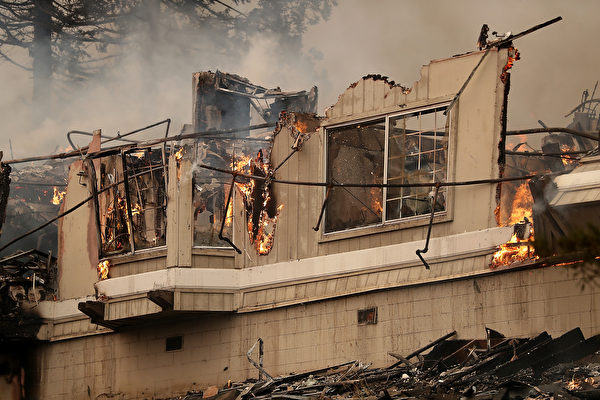 SANTA ROSA, CA - OCTOBER 09: Flames consume a section of the Hilton Sonoma Wine Country on October 9, 2017 in Santa Rosa, California. Ten people have died in wildfires that have burned tens of thousands of acres and destroyed over 1,500 homes and businesses in several Northen California counties. (Photo by Justin Sullivan/Getty Images)