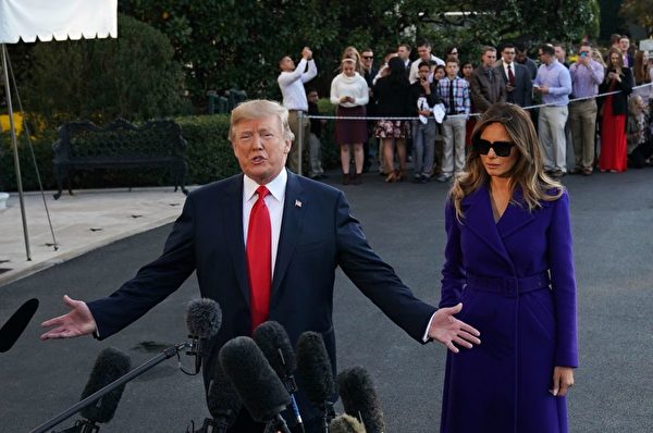 US President Donald Trump and First Lady Melania Trump speak to the press as they make their way to board Marine One before departing from the South Lawn of the White House on November 3, 2017 in Washington, embarking on a 11-day tour of Asia. / AFP PHOTO / MANDEL NGAN (Photo credit should read MANDEL NGAN/AFP/Getty Images)